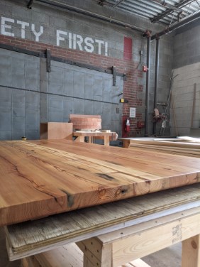 finished table top from side showing end grain and bevel cut on bottom
